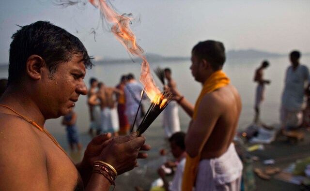 Devotees performing rituals along the Brahmaputra on the day of Mahalaya. Pind daan and shraadh form an important part of the rituals performed in remembrance of ancestors. The Associated Press/ Anupam Nath Devotees performing rituals along the Brahmaputra on the day of Mahalaya. Pind daan and shraadh form an important part of the rituals performed in remembrance of ancestors. The Associated Press/ Anupam Nath